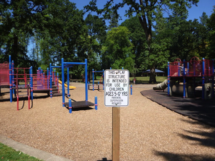 Playground with bark chip surface – rubber matting under some elements – for youth 5-12 years